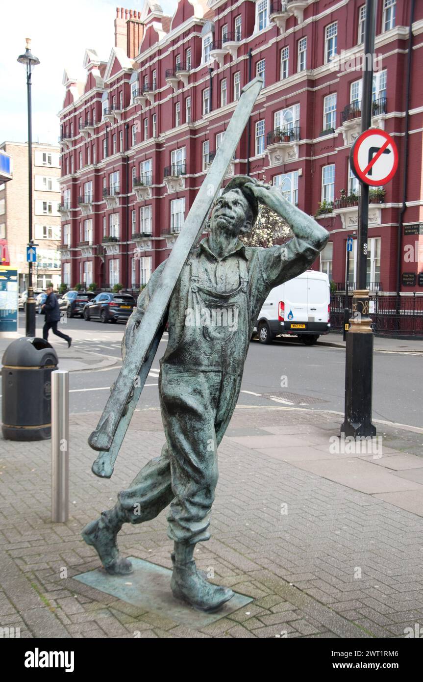 Statue of Young Man with a Ladder outside Edgware Road Tube Station, Chapel Street, London, UK Stock Photo