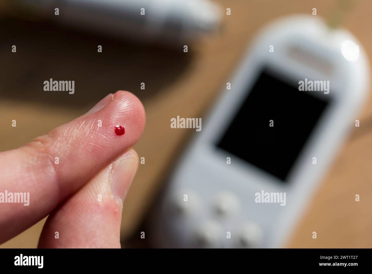 Woman Pricking Her Finger To Check Blood Glucose Level With Glucometer