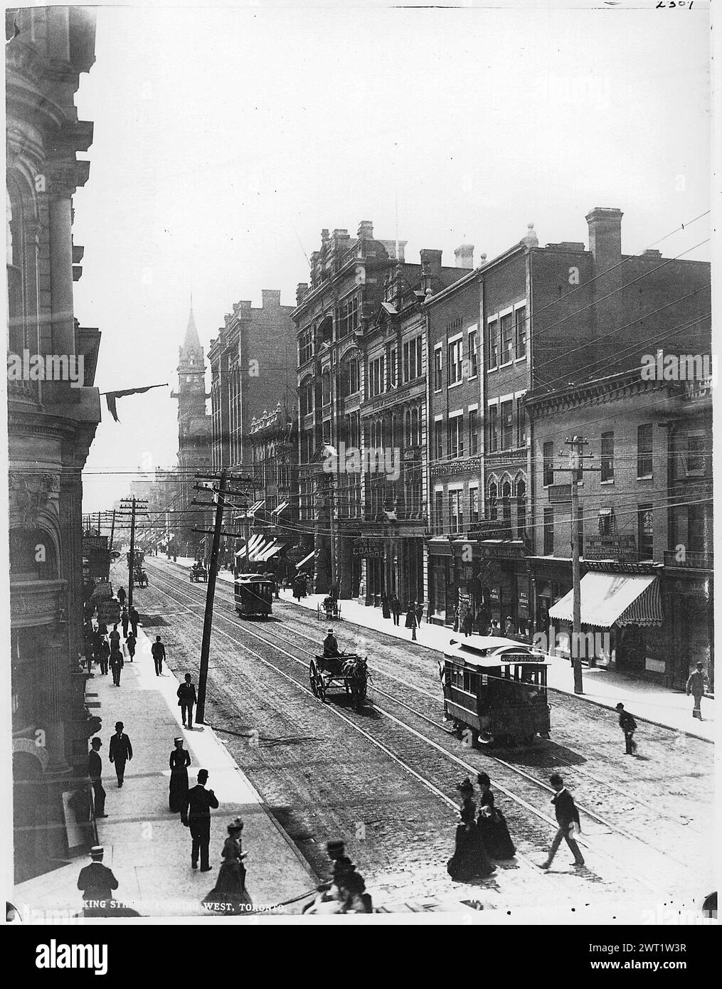 Vintage Street Photography of downtown Toronto.   Streetcar and pedestrians on King Street, Toronto, Ontario, Canada, circa 1890s.   historical photo by Wm. Notman & Son Stock Photo