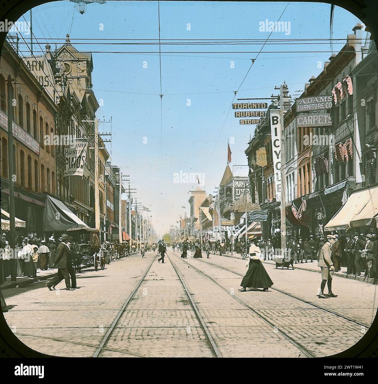 Vintage Colour Street Photography of downtown Toronto.   Streetcar tracks on Yonge Street, Toronto, Ontario, Canada, 1890s.   historical photo by unknown Stock Photo