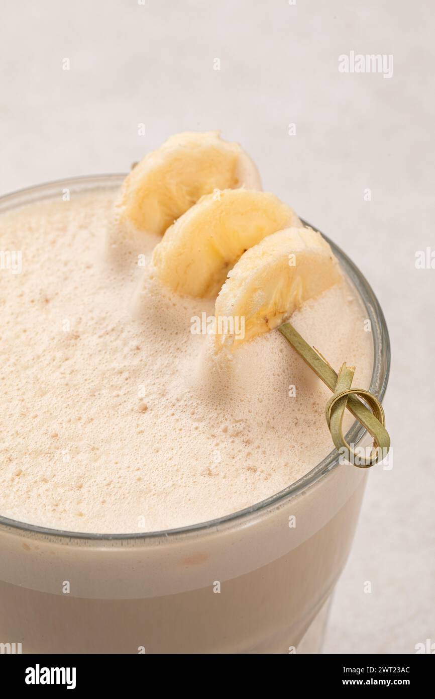 Glass of raf coffee with dried banana Stock Photo