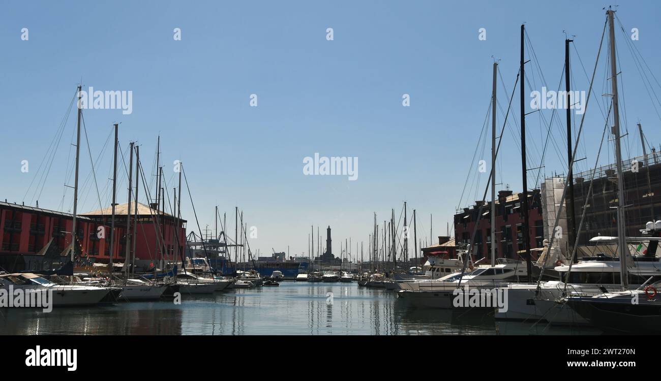 The port of Genoa is a place of great charm with large ships, containers, the Genoa Lantern, the Bigo, the Biosphere and Renzo Piano's Aquarium. Stock Photo