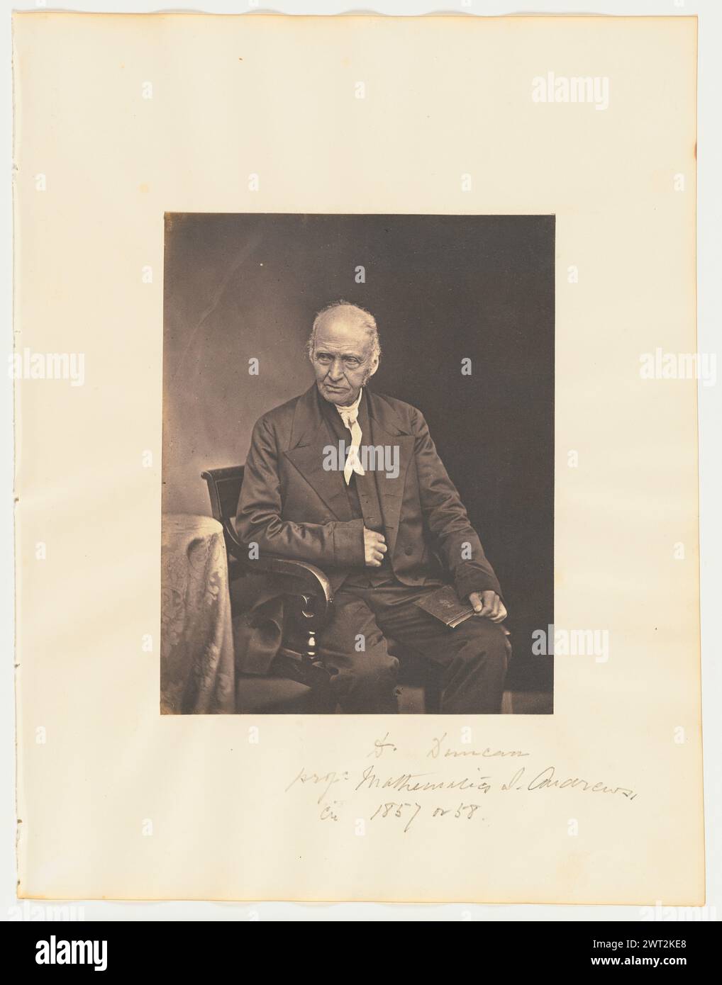 T. Duncan, Professor, Mathematics, St. Andrews. Thomas Rodger, photographer (Scottish, 1832 - 1883) about 1857–1858 A portrait of Professor Thomas Duncan, seated and holding an open book in his lap. (Recto, mount) lower right, pencil: 'T. Duncan/prof: Mathematics S. Andrews/cir 1857 or 58.'; (Verso, mount) upper right, pencil: '32'; Stock Photo