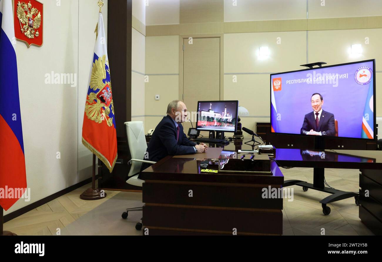 Novo-Ogaryovo, Russia. 15th Mar, 2024. Russian President Vladimir Putin holds a video conference with Yakutia head Aisen Nikolayev from the official presidential residence, March 14, 2024 in Novo-Ogaryovo, Russia. Credit: Mikhail Metzel/Kremlin Pool/Alamy Live News Stock Photo