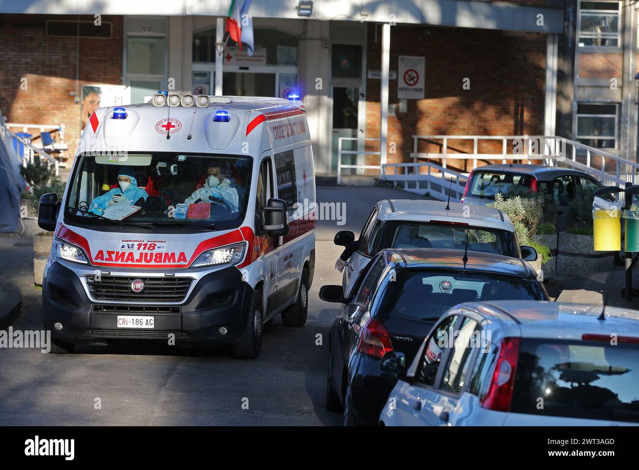 Cars and ambulances queued in front of the Cotugno hospital in Naples, with people waiting to be hospitalized for COVID-9 coronavirus infection. Stock Photo