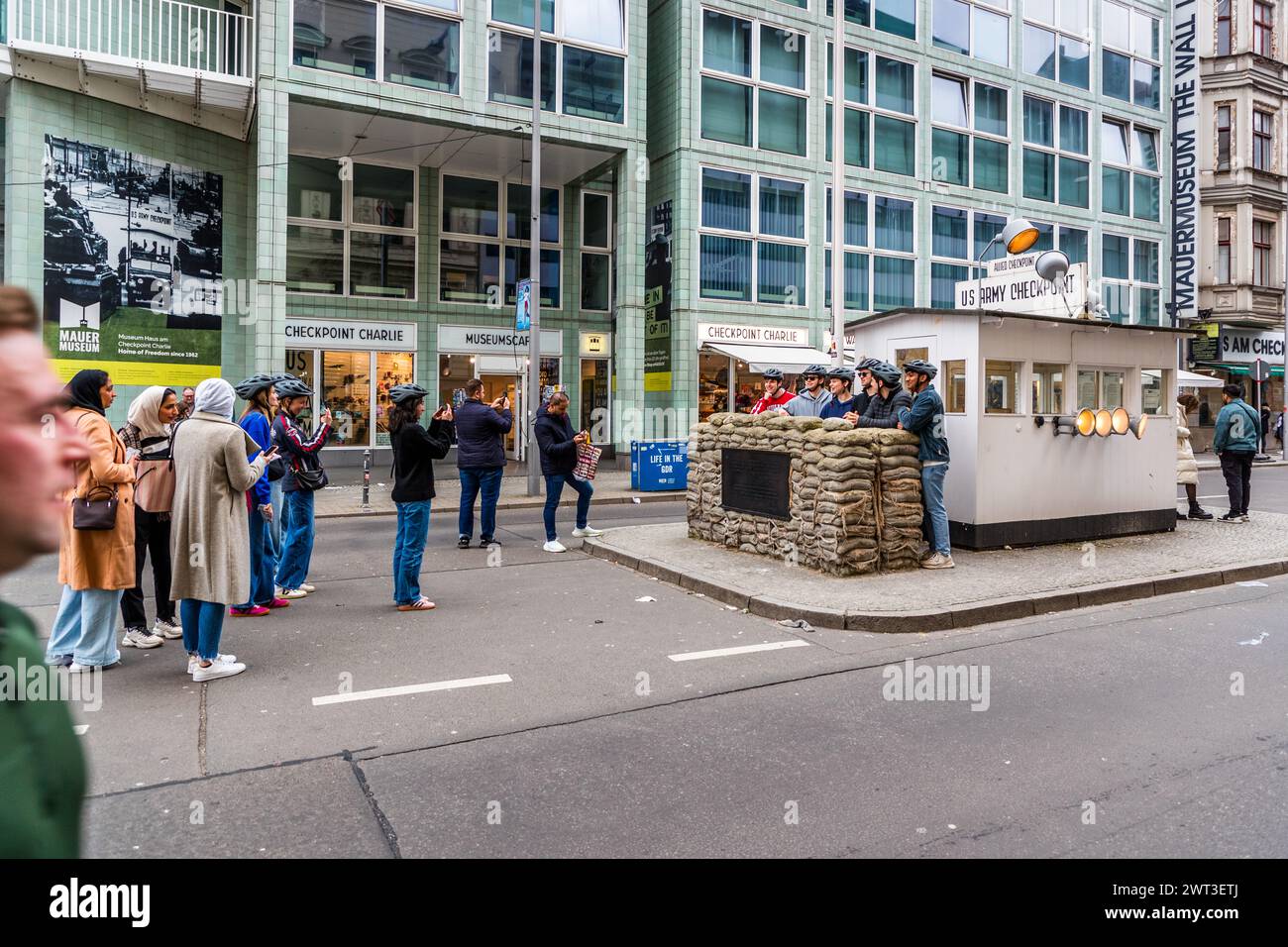 There are many reminders of the Cold War and the divided city of Berlin at Checkpoint Charlie. Friedrichstraße, Berlin, Germany Stock Photo