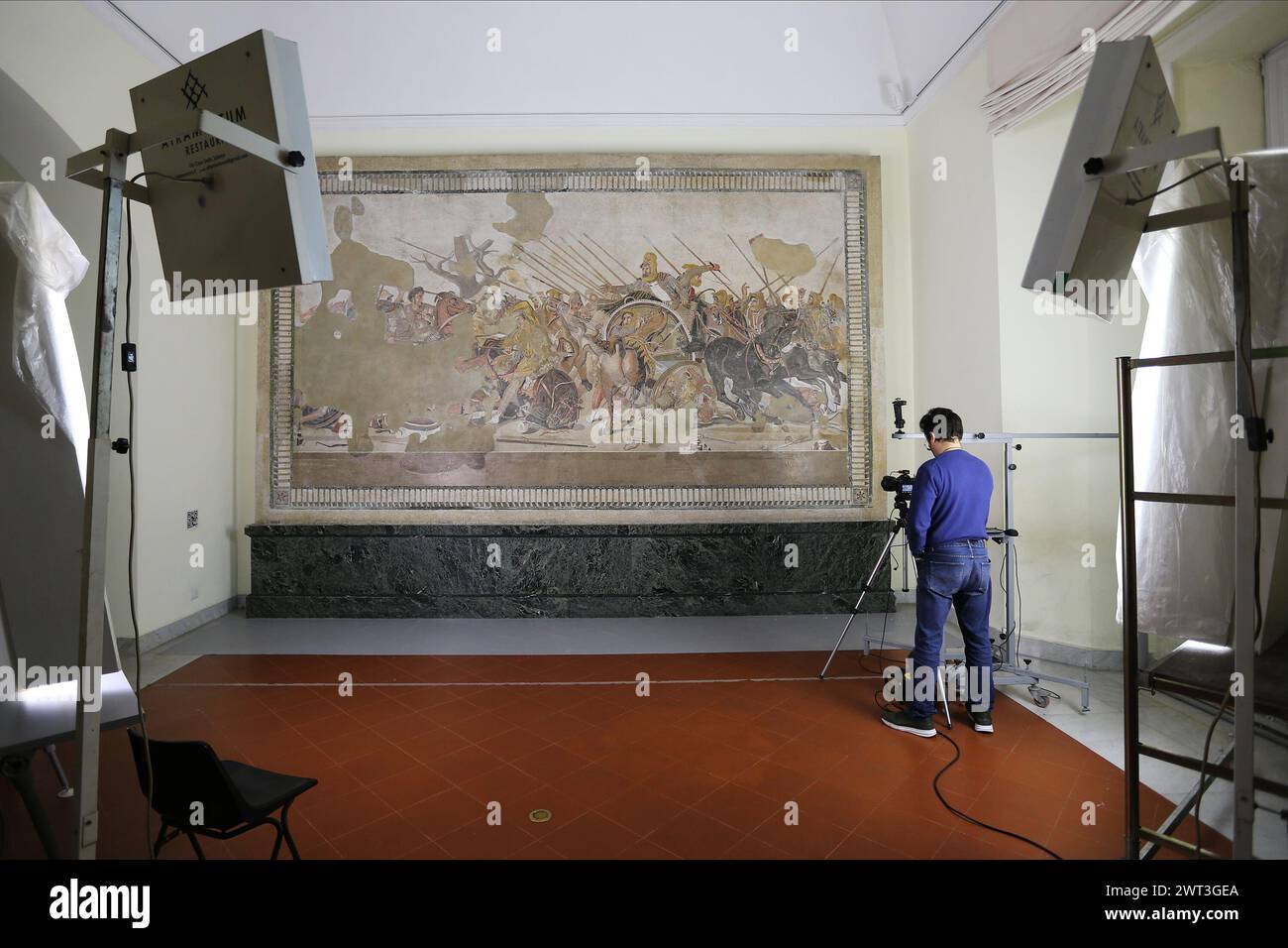 A restorer photographing the Pompeian mosaic known as Alexander the ...