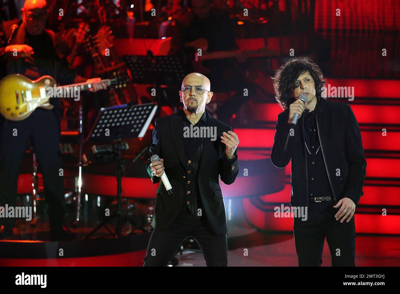 The singers Enrico Ruggeri and Ermal Meta during the TV show Una Storia Da Cantare, in the Rai auditorium in Naples. Stock Photo