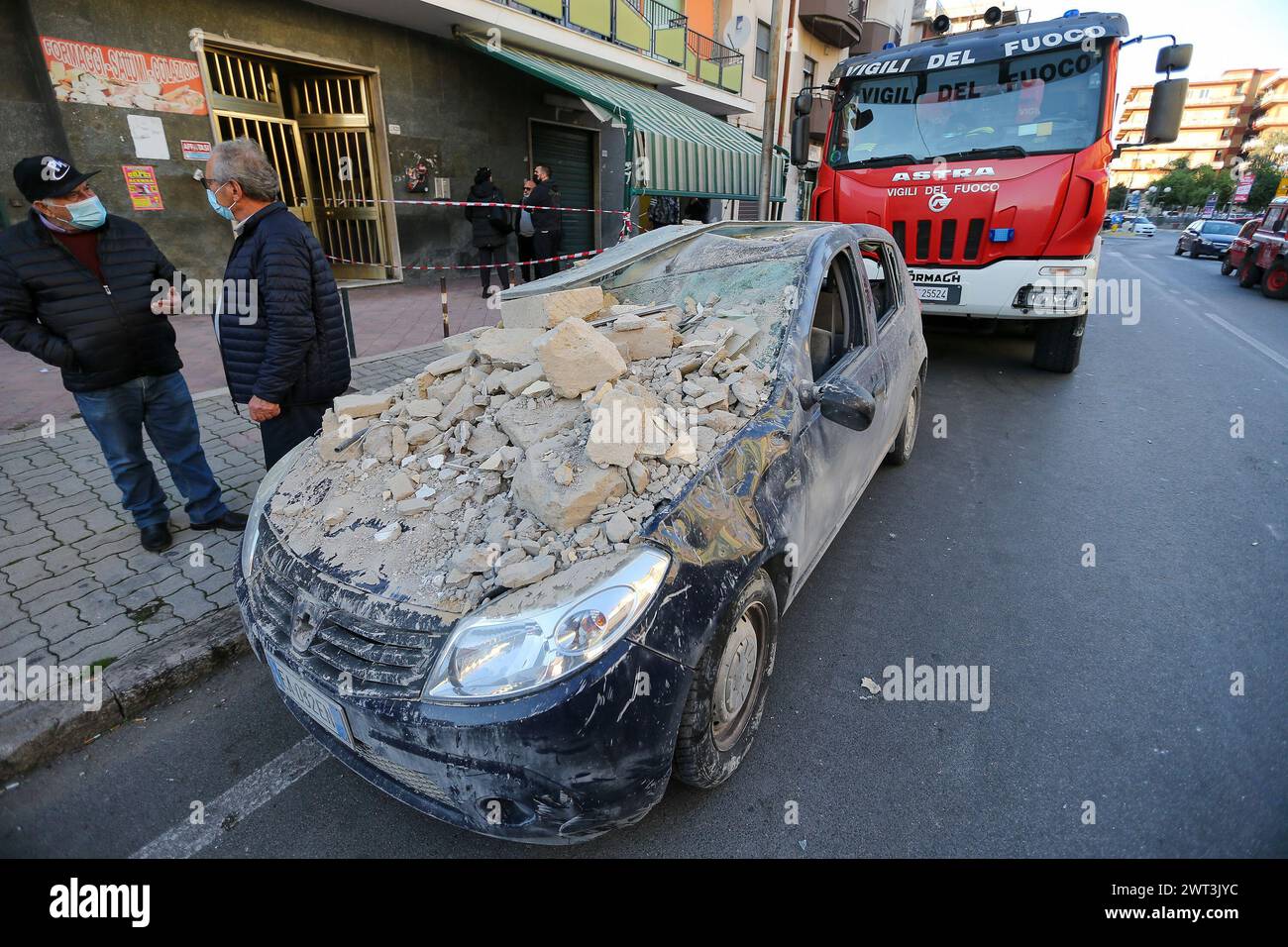 A car completely submerged by the rubble of the completely collapsed building in San Felice Cancello, in the province of Caserta, following an explosi Stock Photo