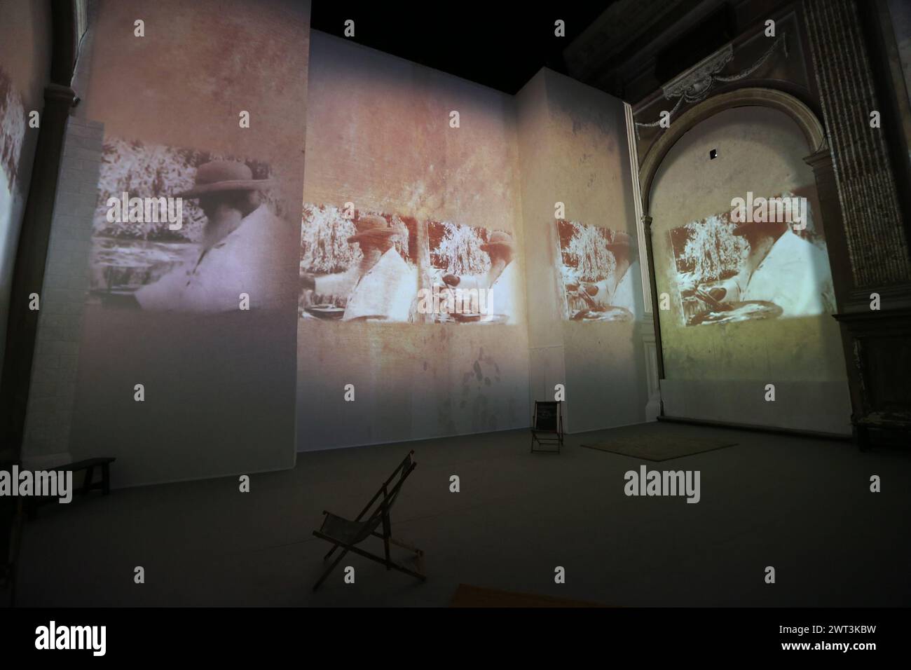 Photographs of Claude Monet projected on the walls, inside the “Monet ...