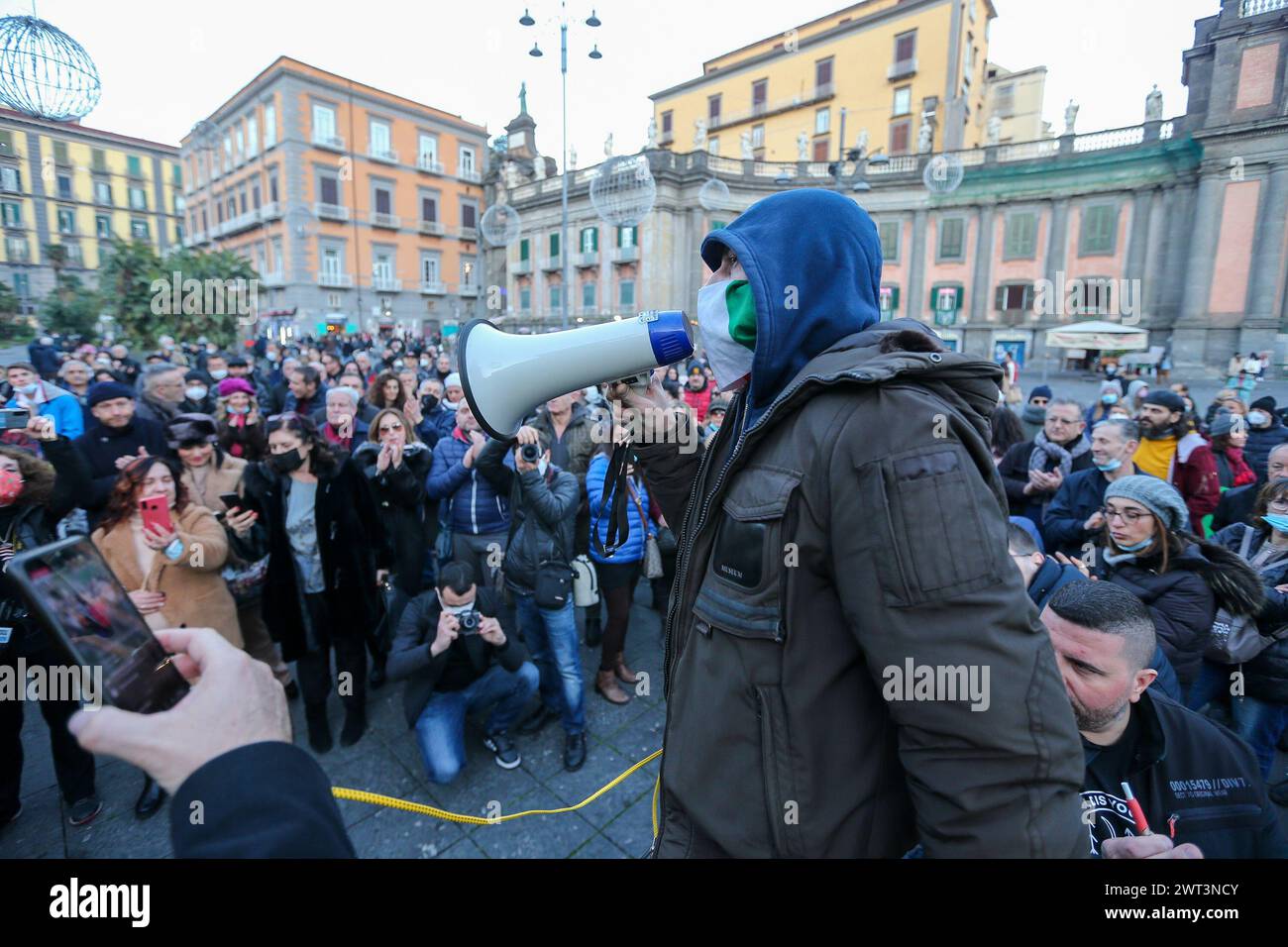 A man of the No Vax movement speaks with a megaphone during the No Green Pass and No Vax demonstration in Naples. Stock Photo