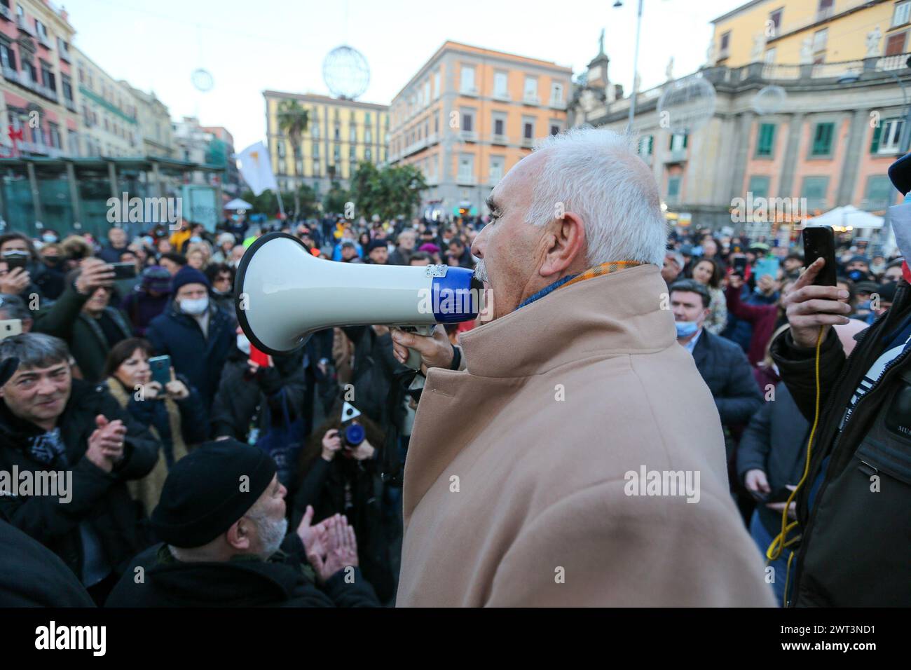 Former general Antonio Pappalardo, leader of the orange vests, speaks with a megaphone during the No Green Pass and No Vax demonstration in Naples. Stock Photo