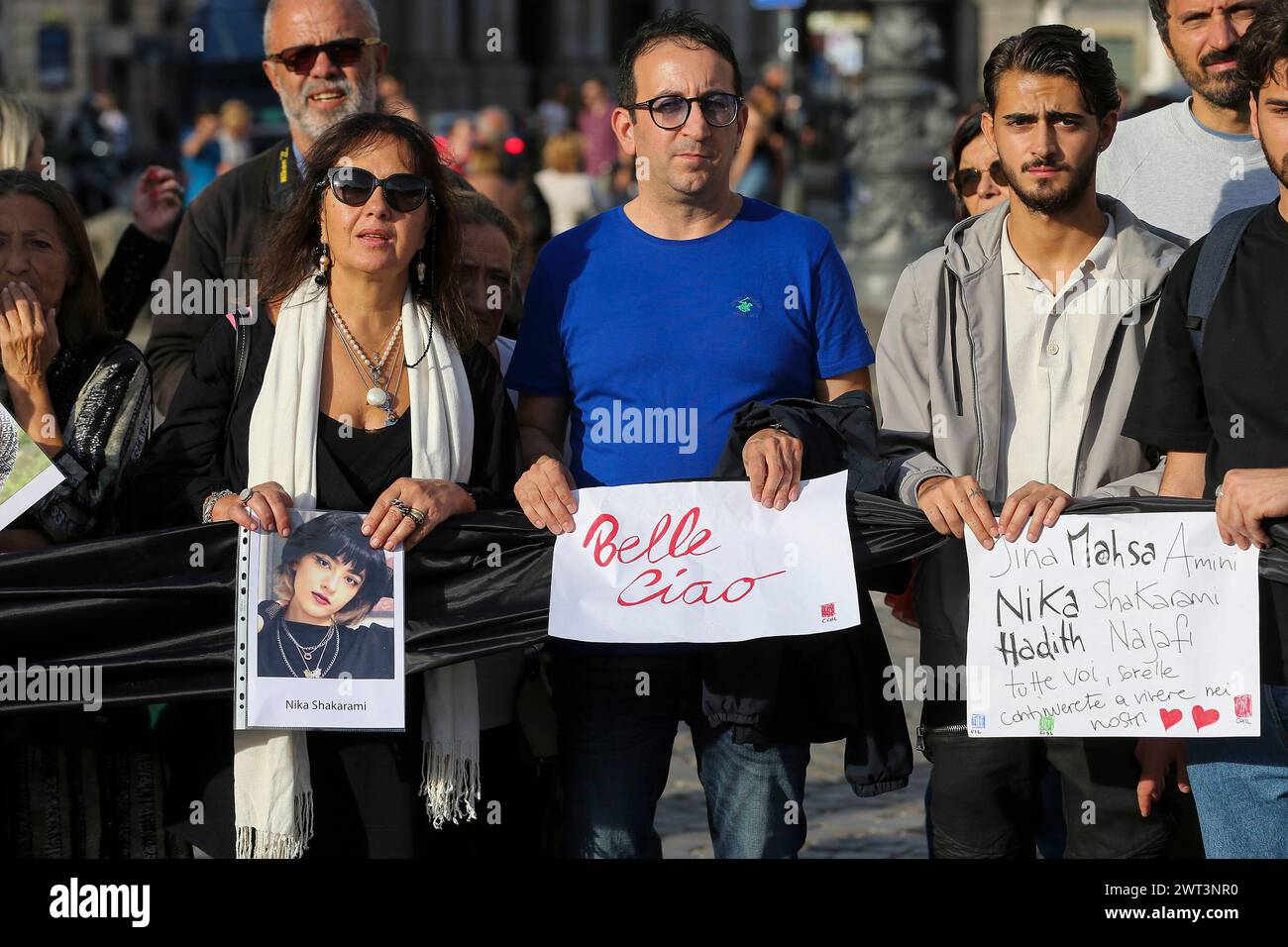 People with placards and photographs of Iranian women, during the ...