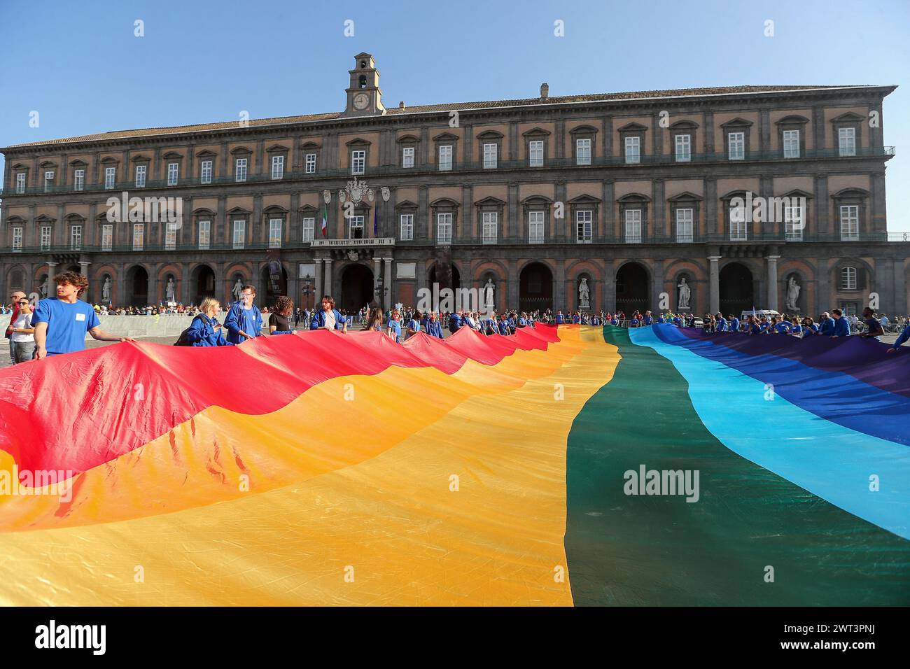 People with a giant rainbow flag, during the demonstration for peace and cease-fire in Ukraine, after the invasion by Russia in February 2022. Stock Photo