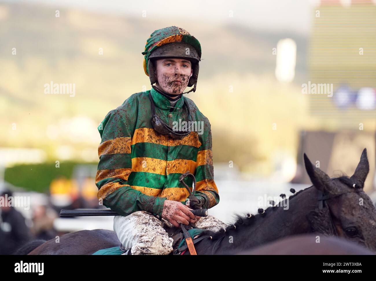 Mike O'Connor covered in mud following the Martin Pipe Conditional Jockeys' Handicap Hurdle on day four of the 2024 Cheltenham Festival at Cheltenham Racecourse. Picture date: Friday March 15, 2024. Stock Photo