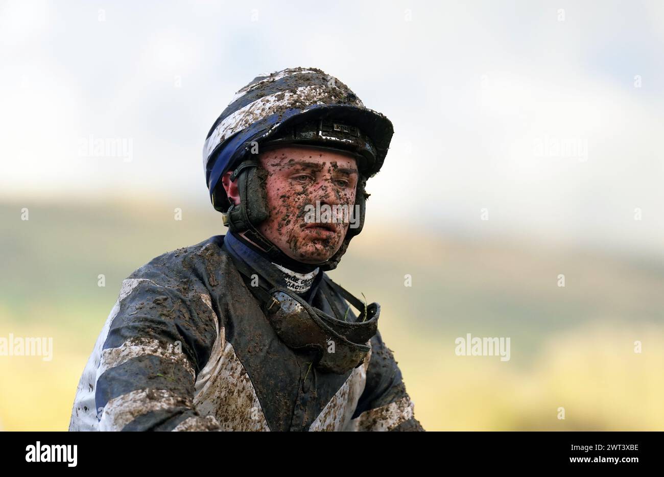 Dylan Johnston covered in mud following the Martin Pipe Conditional Jockeys' Handicap Hurdle on day four of the 2024 Cheltenham Festival at Cheltenham Racecourse. Picture date: Friday March 15, 2024. Stock Photo