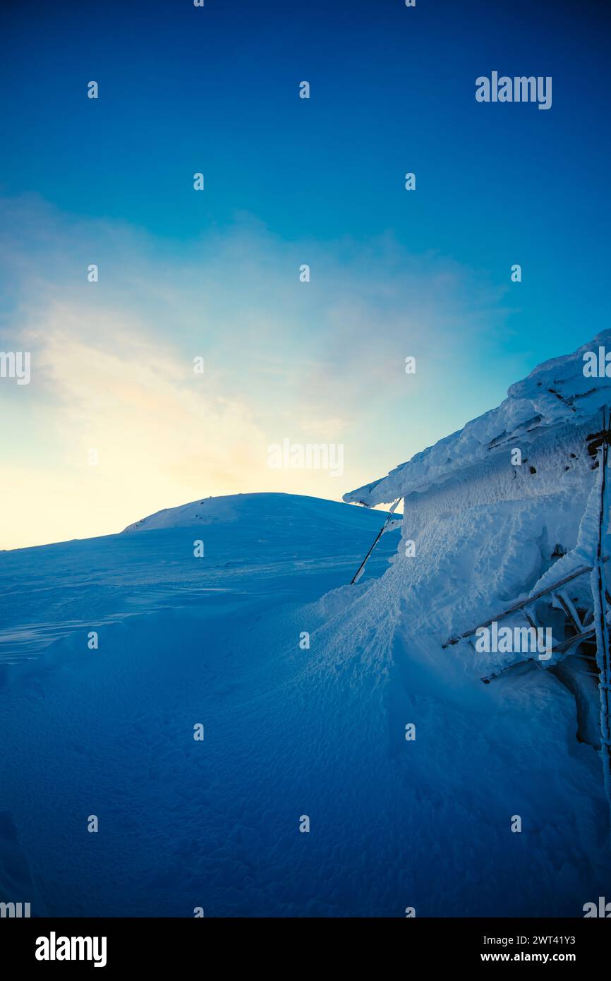 An inverted snowy slope in a winter landscape Stock Photo