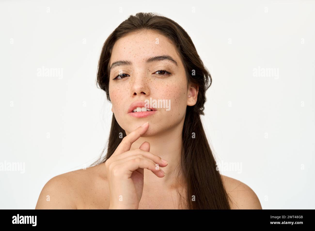 Pretty Latin young woman, freckles on face, beauty portrait isolated on white. Stock Photo