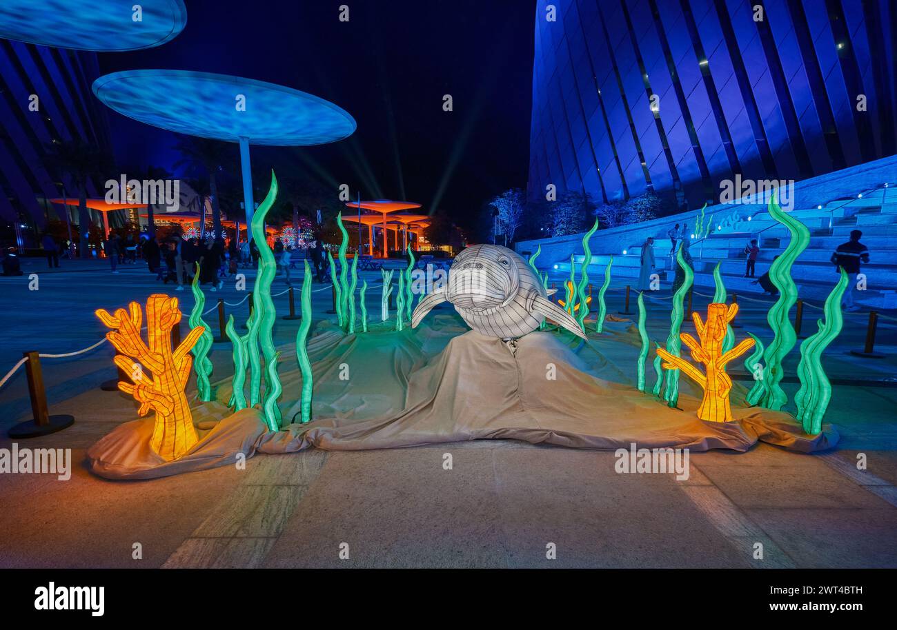 Luminous Festival Lusail 2024 in Lusail Boulevard, Qatar  night shot showing vibrant light displays, fountain with crowds of people watching Stock Photo