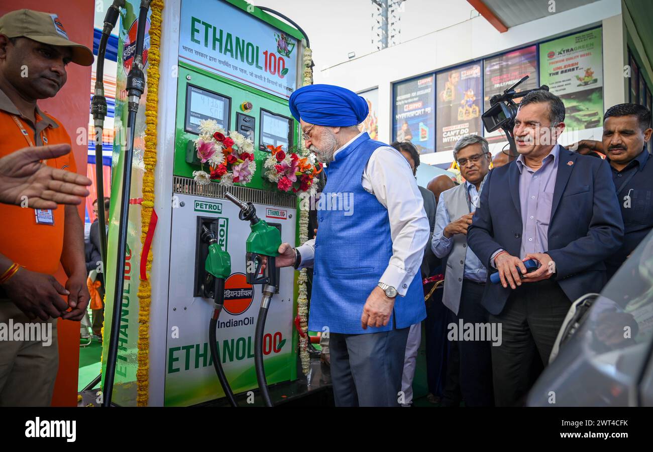 NEW DELHI, INDIA - MARCH 15: Union Minister of Petroleum and Natural Gas Hardeep Singh Puri fills a car with Ethanol-blended petrol during the launch of ‘Ethanol 100' at Indian Oil's Irwin Road Service Station on March 15, 2024 in New Delhi, India. According to an official statement, ETHANOL 100 stands as a cleaner, greener alternative to gasoline, boasting lower emissions of greenhouse gases and pollutants, thus aiding in combating climate change and enhancing air quality in our communities. With its high-octane rating, typically between 100-105, ETHANOL 100 proves ideal for high-performance Stock Photo