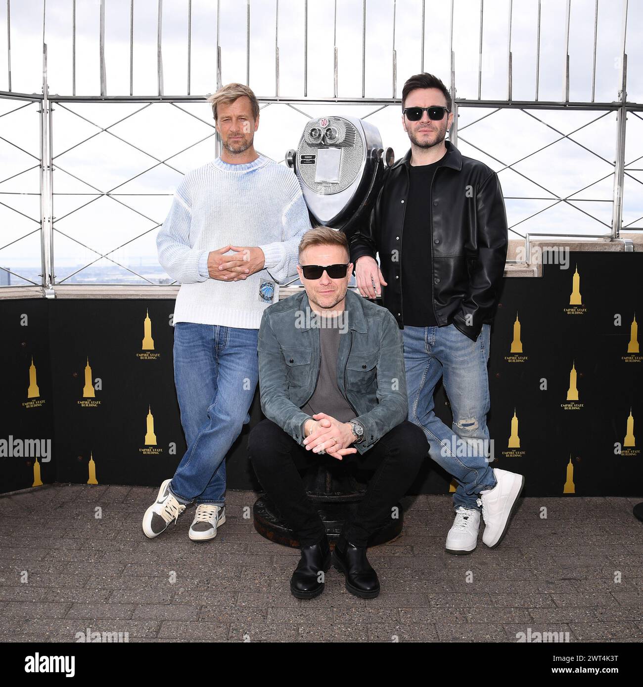 New York, USA. 15th Mar, 2024. Members of the Irish pop group Westlife, (l-r) Kian Egan, Nicky Byrne and Shane Filan pose during the lighting ceremony of the Empire State Building to celebrate St. Patrick's Day, New York, NY, March 15, 2024. Photo by Anthony Behar/Sipa USA) Credit: Sipa USA/Alamy Live News Stock Photo