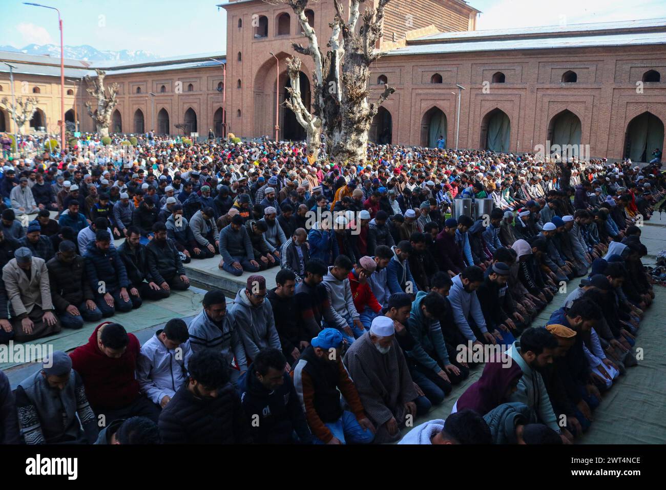 Srinagar, India. 15th Mar, 2024. March 15, 2024, Srinagar, India : Kashmiri Kashmiri Muslims offer prayers outside the Jamia Masjid or Grand Mosque on the first Friday of Ramadan in Srinagar. Muslims throughout the world are marking the holy month of Ramadan, when the faithful fast from dawn to dusk. on March 15, 2024, Srinagar, India. (Photo By Firdous Nazir/ Credit: Eyepix Group/Alamy Live News Stock Photo