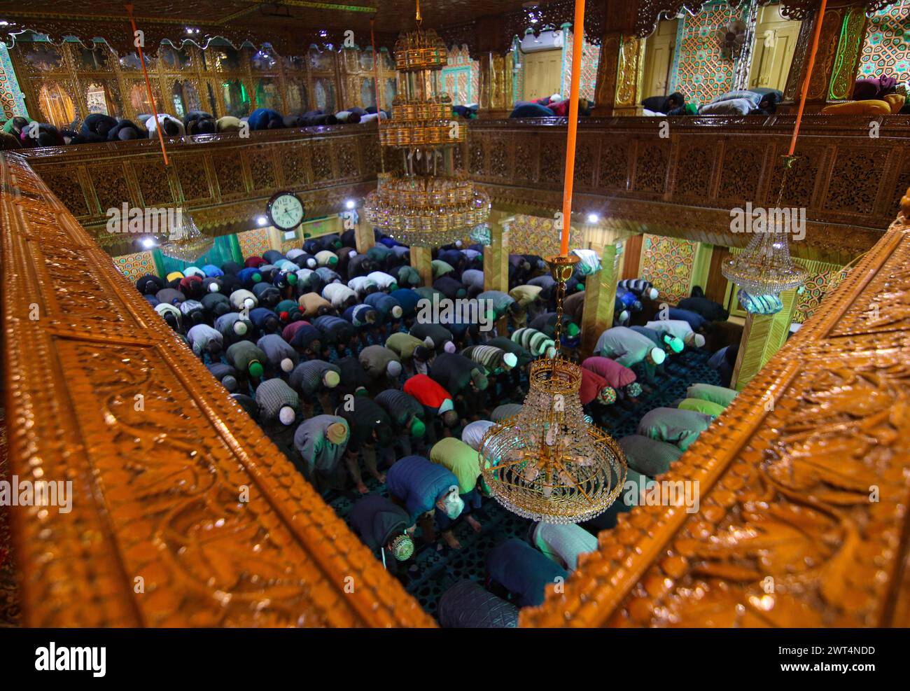 Srinagar, India. 15th Mar, 2024. March 15, 2024, Srinagar, India : Kashmiri Muslims offer prayers inside a shrine on the first Friday of Ramadan in Srinagar. Muslims throughout the world are marking the holy month of Ramadan, when the faithful fast from dawn to dusk. on March 15, 2024, Srinagar, India. (Photo By Firdous Nazir/ Credit: Eyepix Group/Alamy Live News Stock Photo