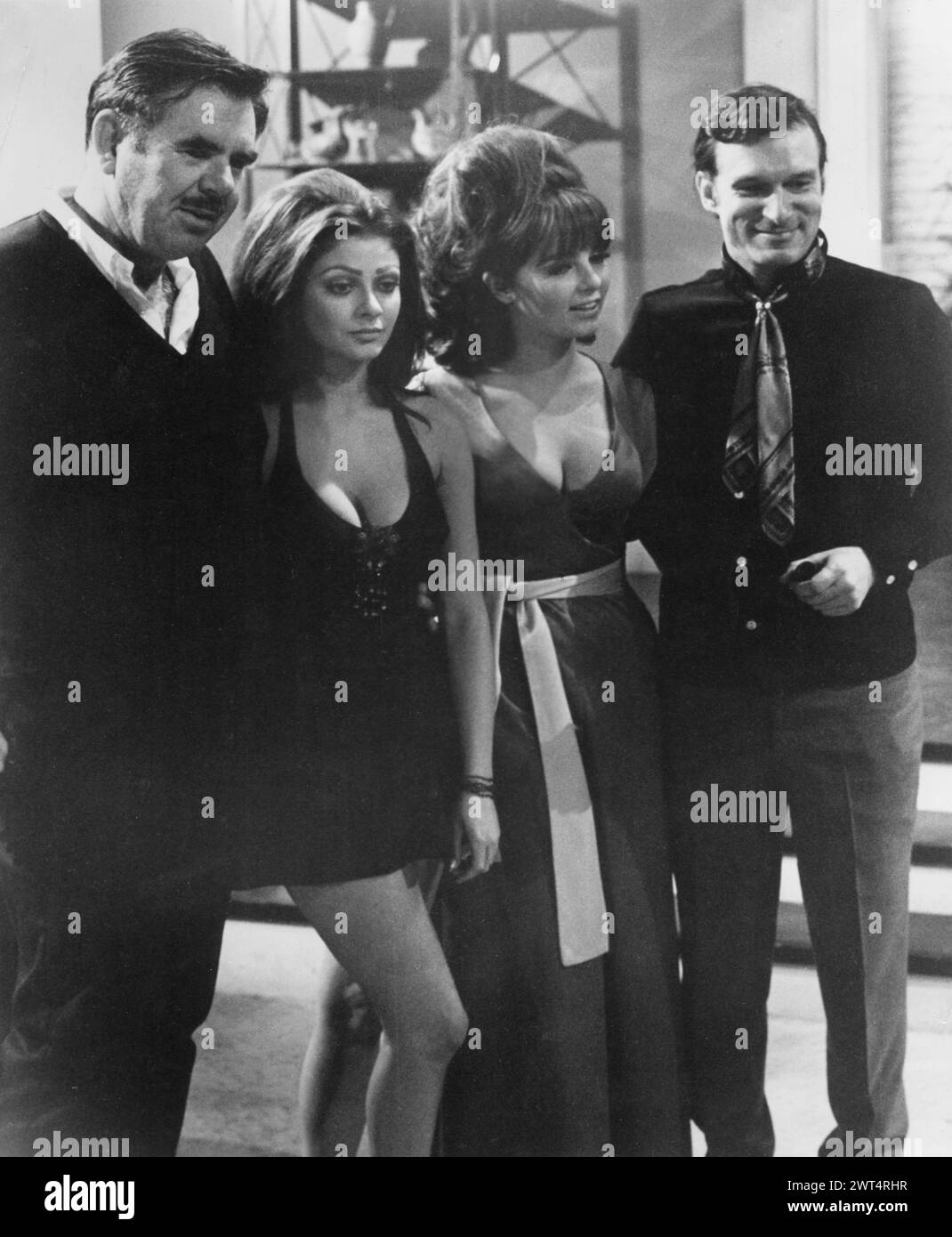 Film Director RUSS MEYER with CYNTHIA MYERS, DOLLY READ and PLAYBOY publisher HUGH HEFNER on the set of BEYOND THE VALLEY OF THE DOLLS 1970 20th Century Fox Stock Photo