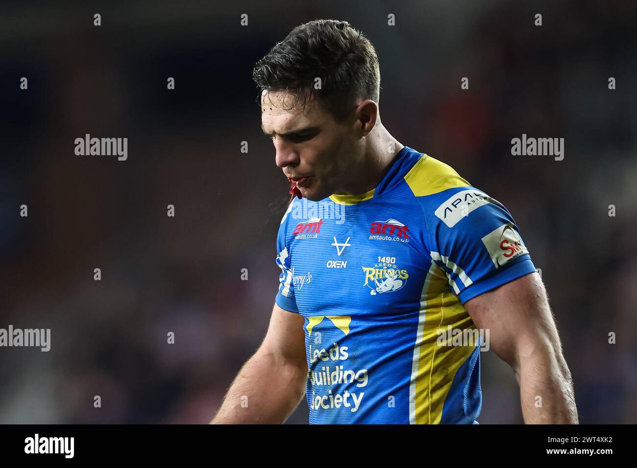 *** Graphic Content *** Brodie Croft of Leeds Rhinos spits up blood during the Betfred Super League Round 5 match Leeds Rhinos vs St Helens at Headingley Stadium, Leeds, United Kingdom, 15th March 2024  (Photo by Mark Cosgrove/News Images) Stock Photo