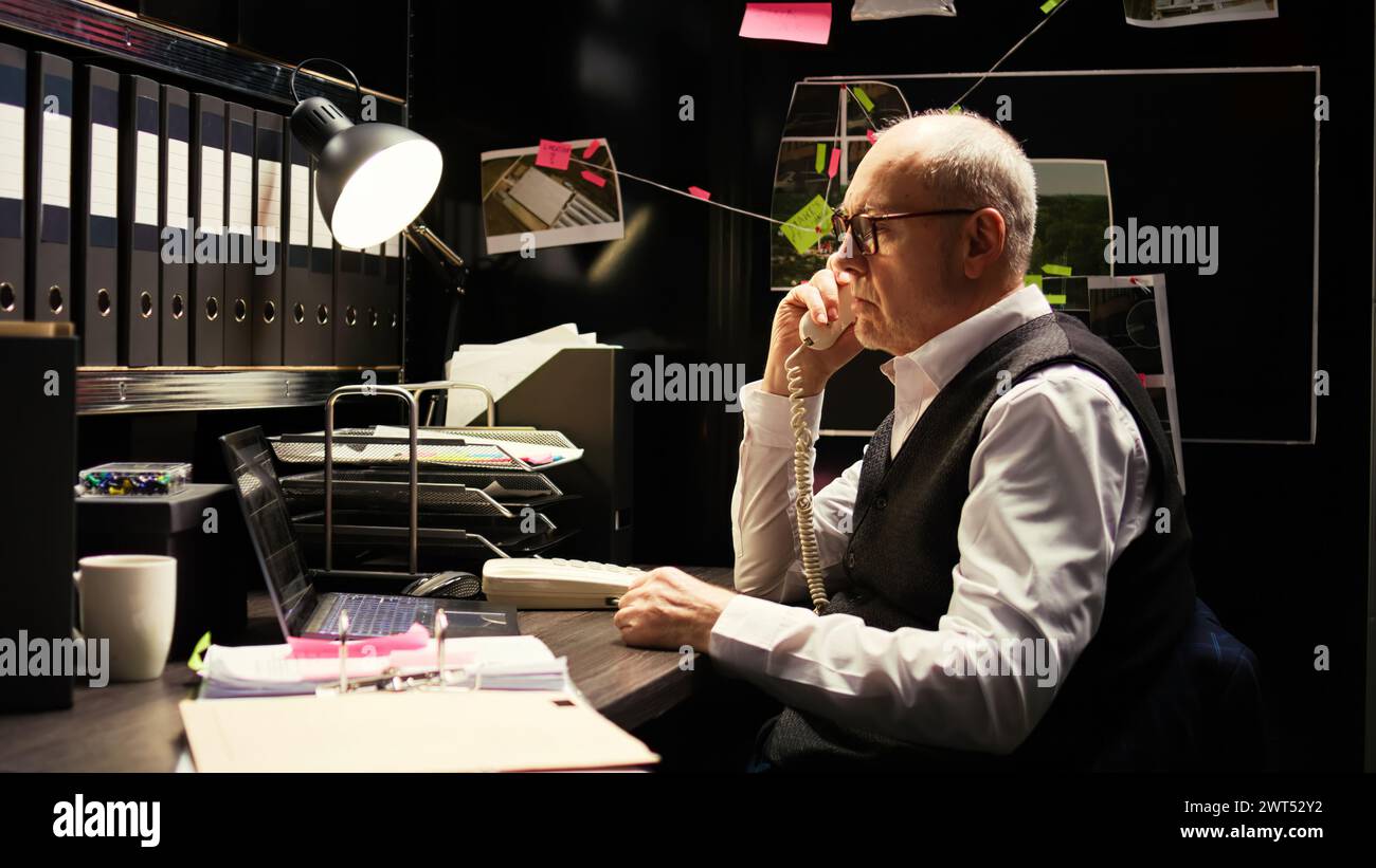 Detective using landline phone in evidence room, receiving call from