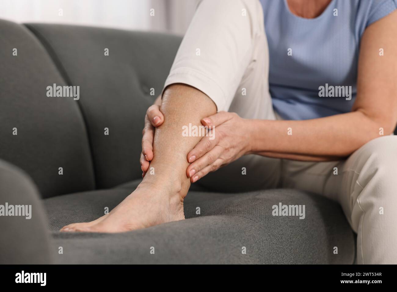Arthritis Symptoms Woman Suffering From Pain In Leg At Home Closeup 