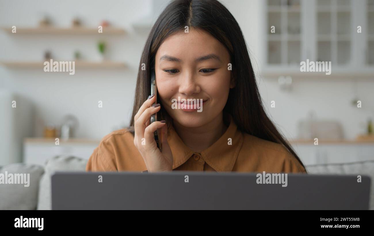 Asian Chinese multitasking businesswoman korean woman working laptop ...