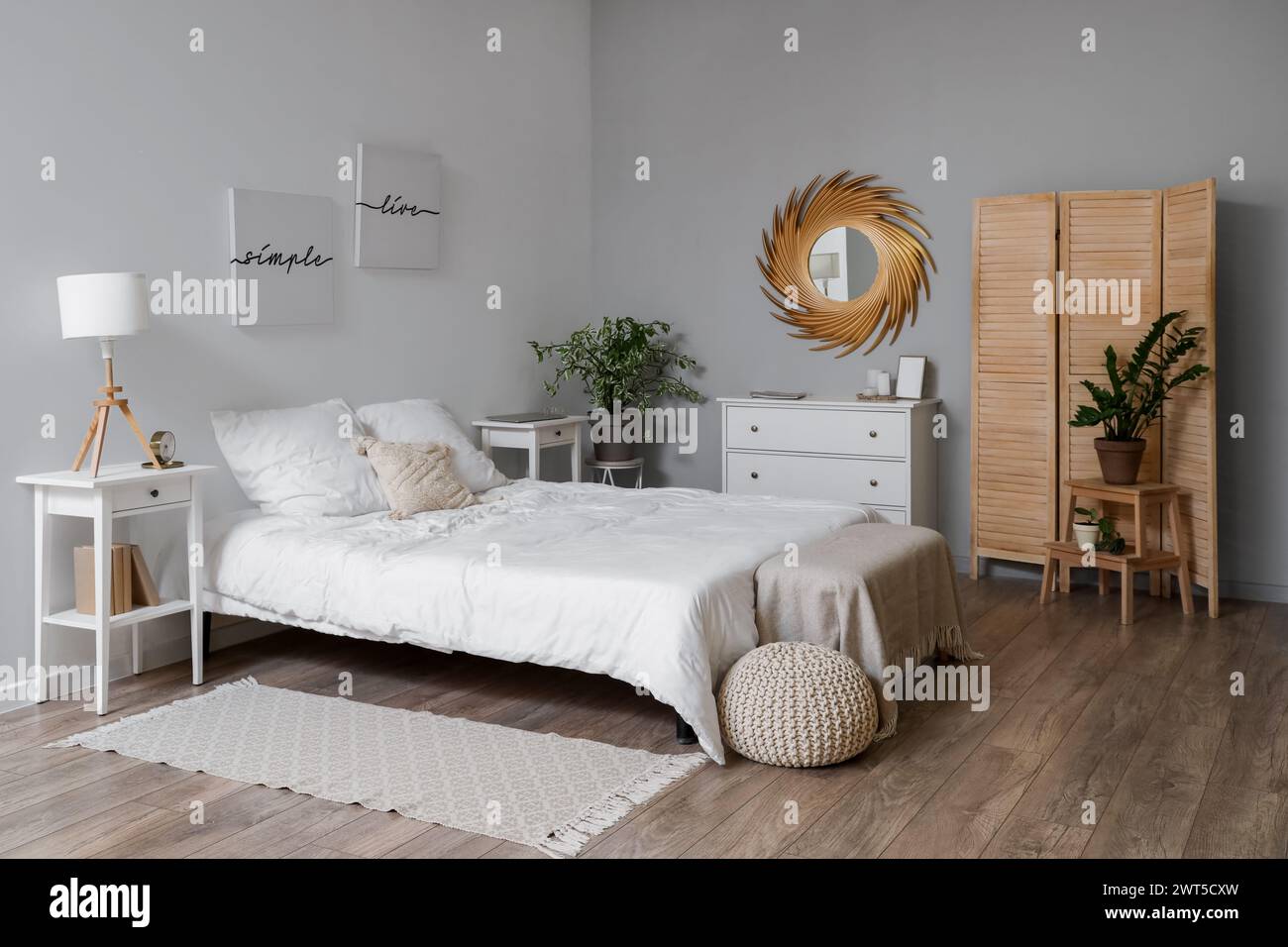 Stylish interior of modern bedroom with cozy bed Stock Photo - Alamy