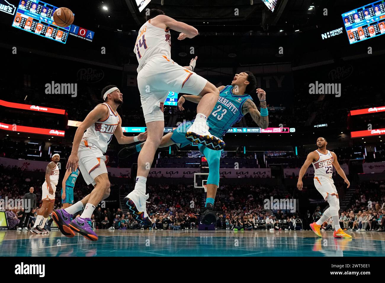Tree Mann Charlotte Hornets guard Tre Mann is fouled by Phoenix Suns forward Drew ...