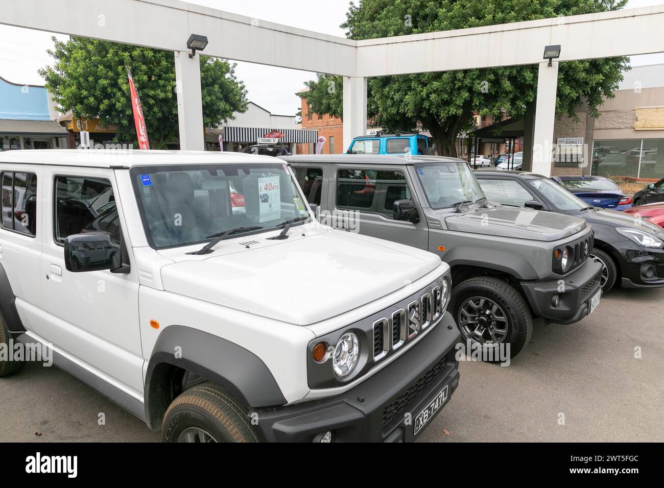 White and grey Suzuki Jimny 4wd vehicles for sale at a car dealership in Barossa Valley,South Australia,2024 Stock Photo