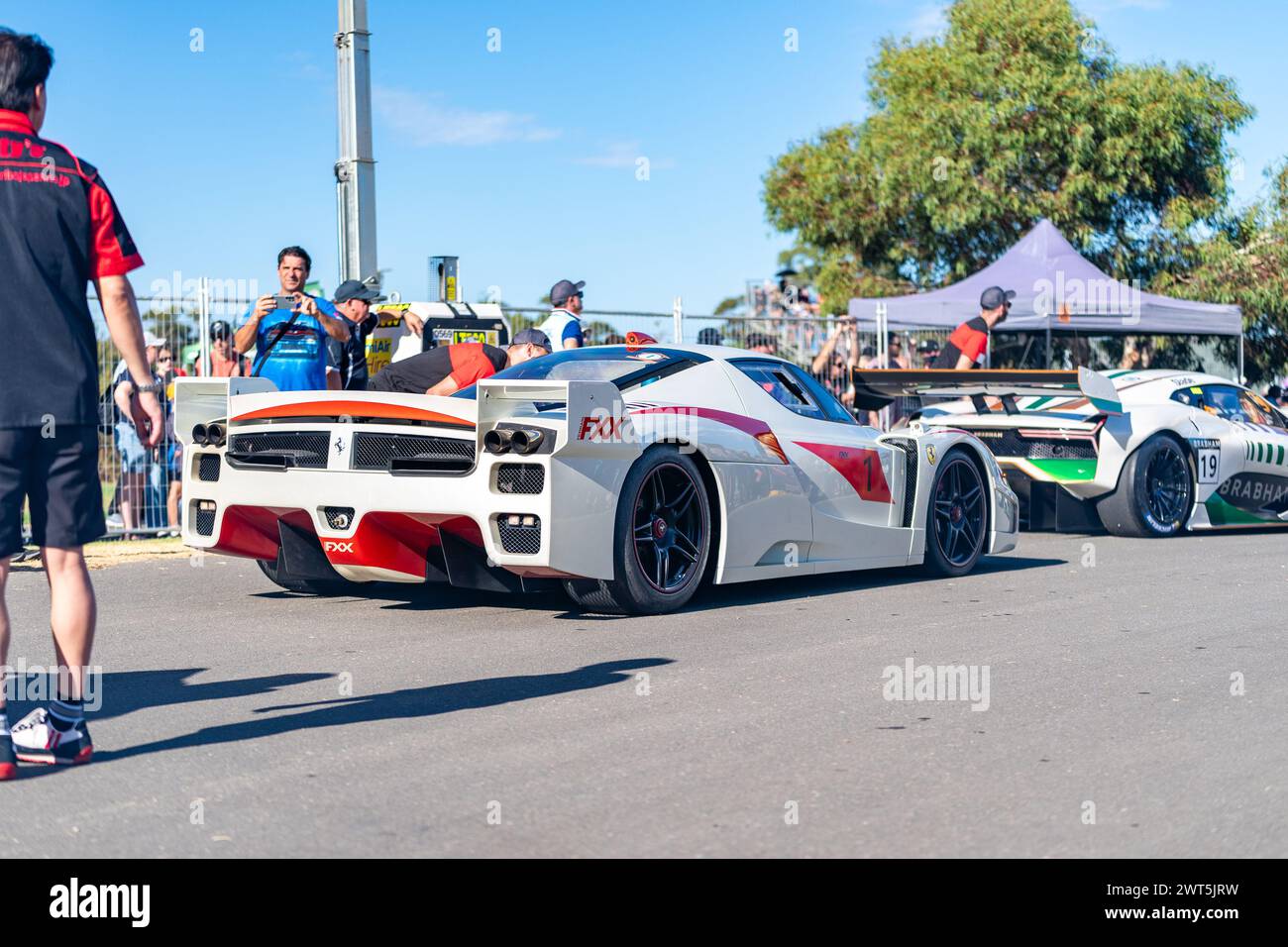 Adelaide, Australia. 16 March, 2024. The Ferrari FXX, driven by Craig Lowndes, sits in dummy grid before heading out on Saturday at the 2024 Repco Adelaide Motorsport Festival. Credit: James Forrester/Alamy Live News Stock Photo
