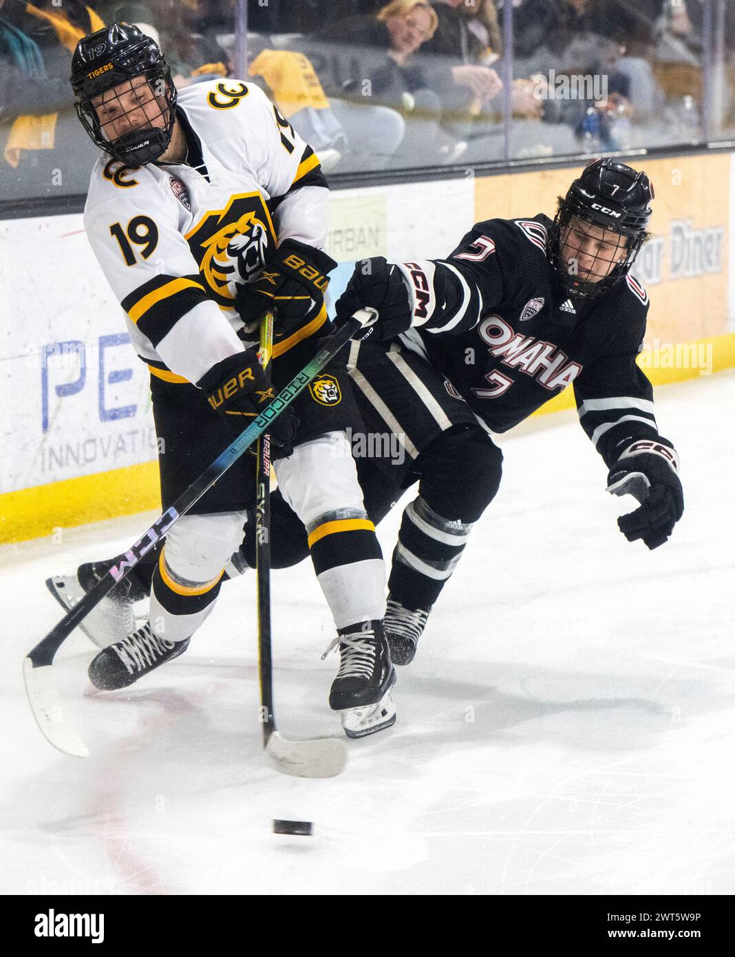 Colorado College Forward Evan Werner (19) Shoots As Omaha Defenseman ...