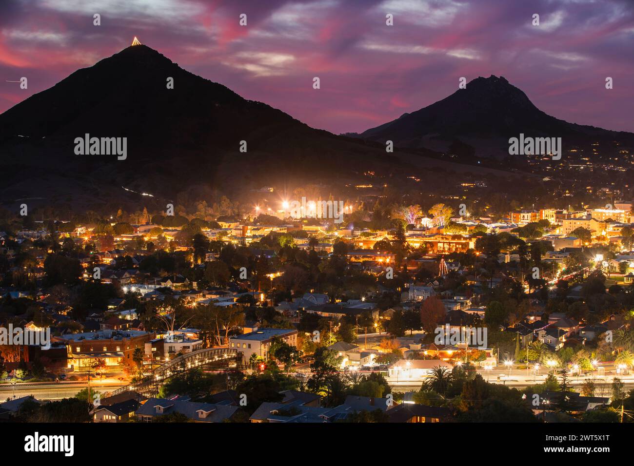 Beautiful elevated twilight sunset view of the evening lights of downtown San Luis Obispo, California, USA. Stock Photo