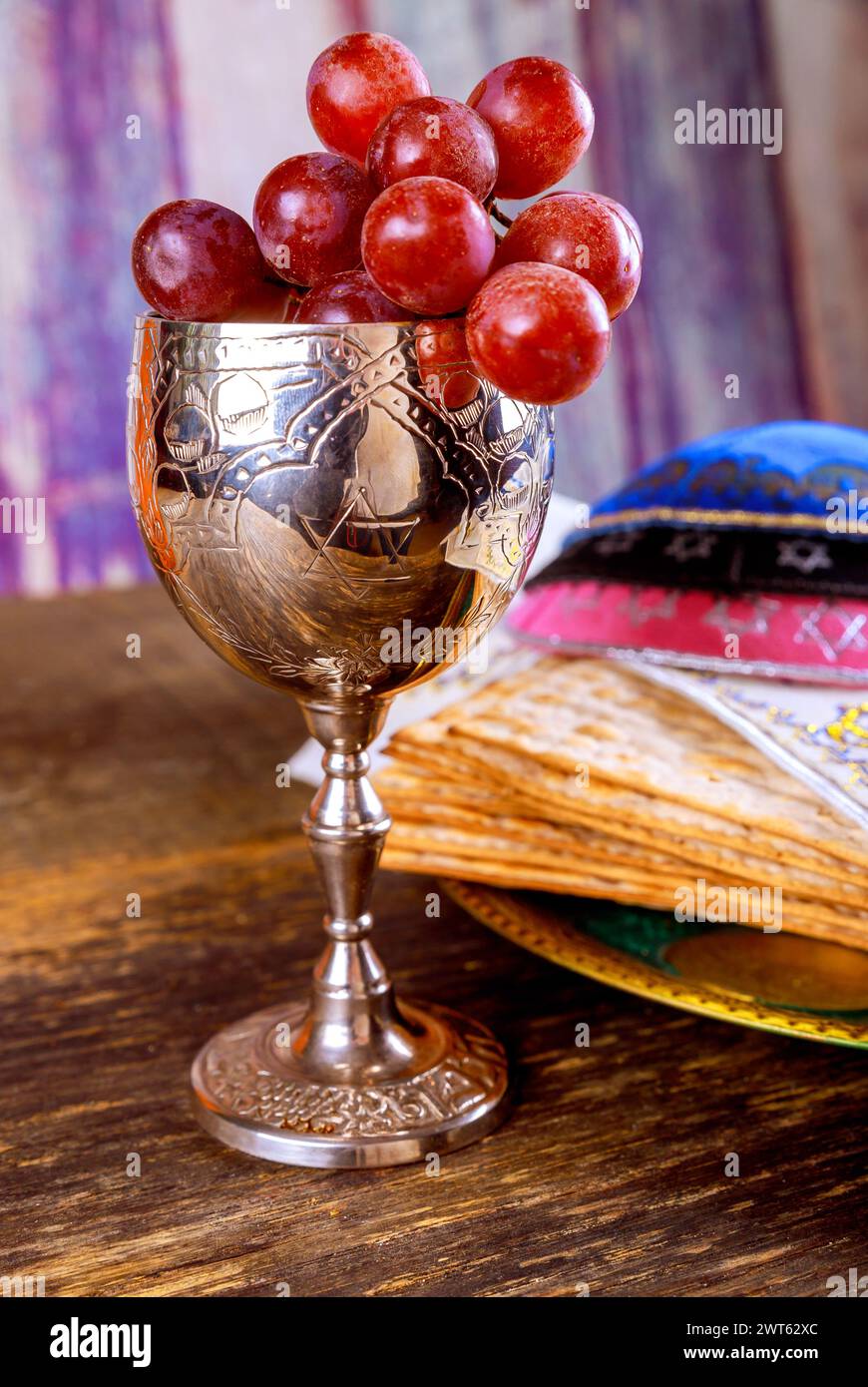 Jewish matzah unleavened bread, wine cup with Passover holiday attributes Stock Photo
