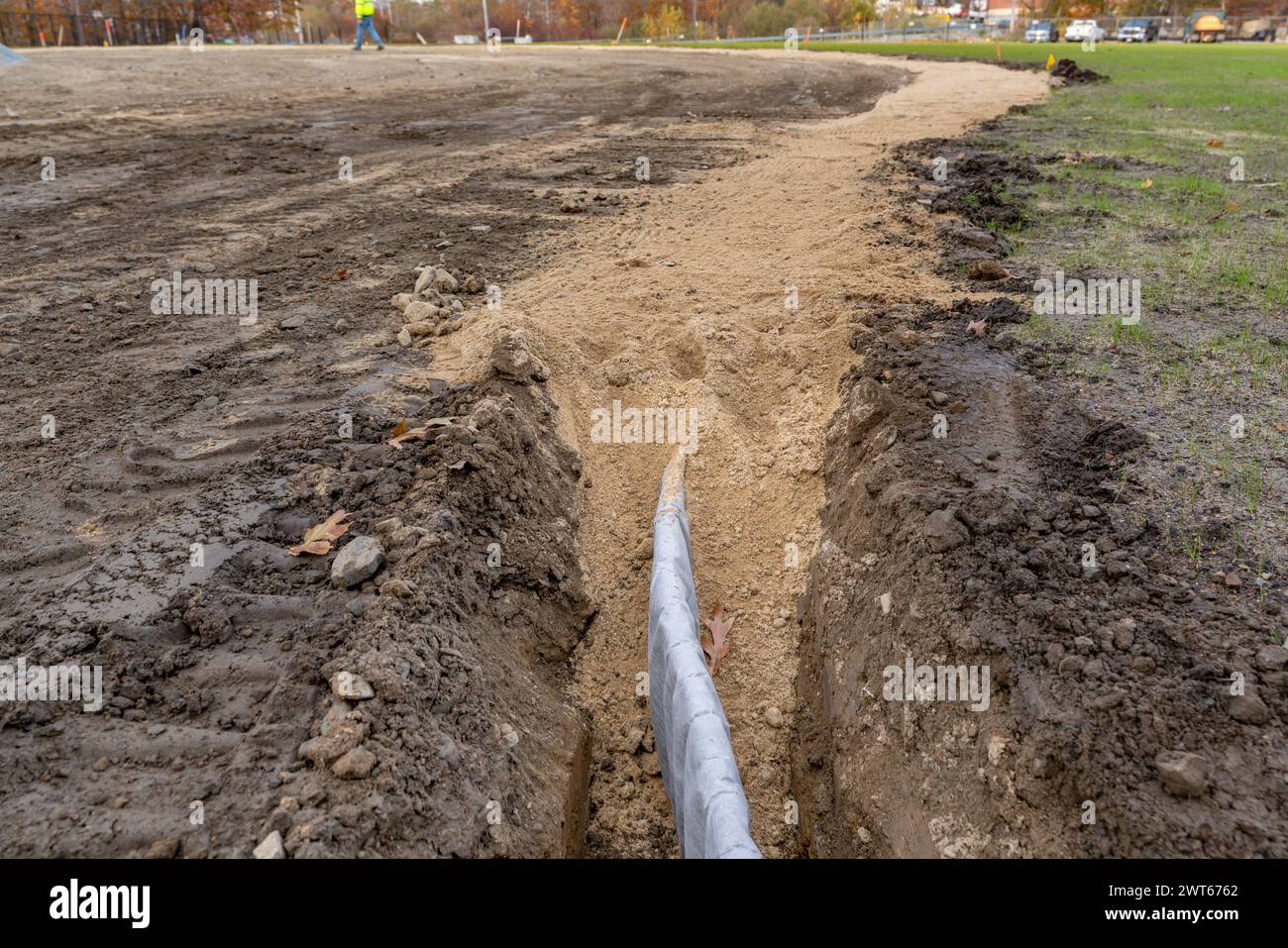 Construction photo of natural turf athletic field vertical edge drain