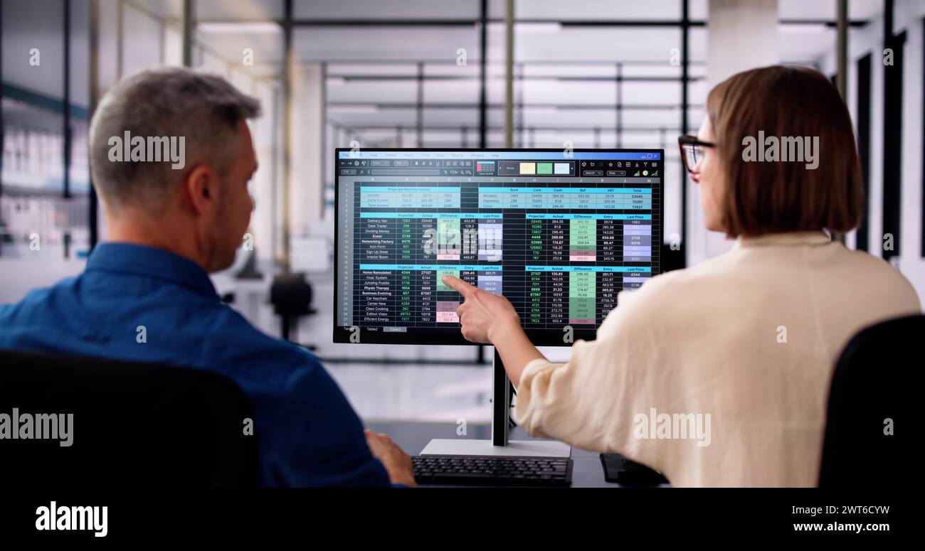 Analyst Employee Working On Spreadsheet Using Desktop Computer Stock ...