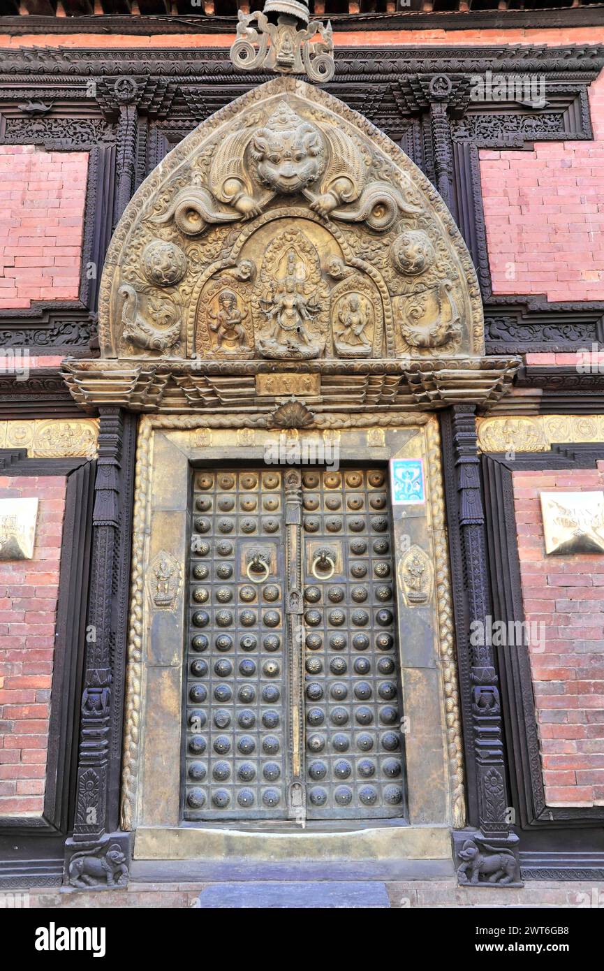 Detailed carved wooden door of a traditional Newar building in Nepal, Kathmandu Valley. Kathmandu, Nepal Stock Photo