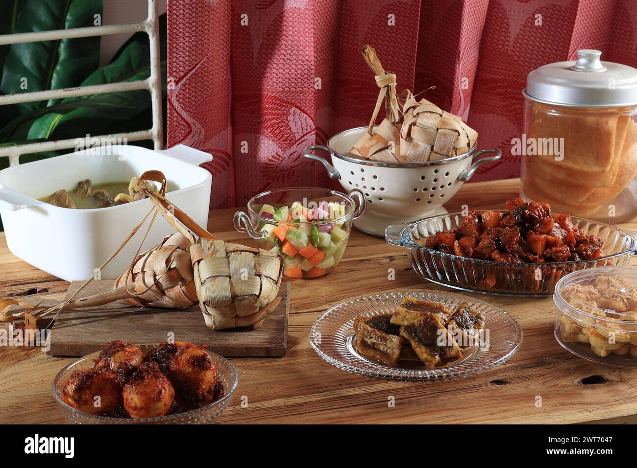 Ketupat Lebaran and Various Side Dish on the Table. Eid al Fitr Menu Stock Photo