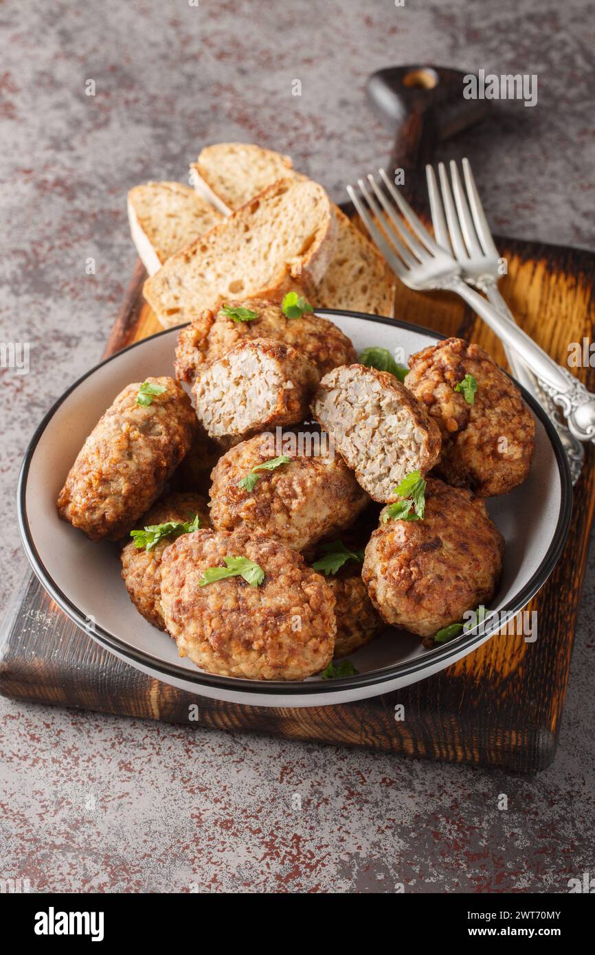 Ukrainian buckwheat Hrechanyky are prepared from minced meat and boiled buckwheat porridge with the addition of onions, spices close-up in a plate on Stock Photo