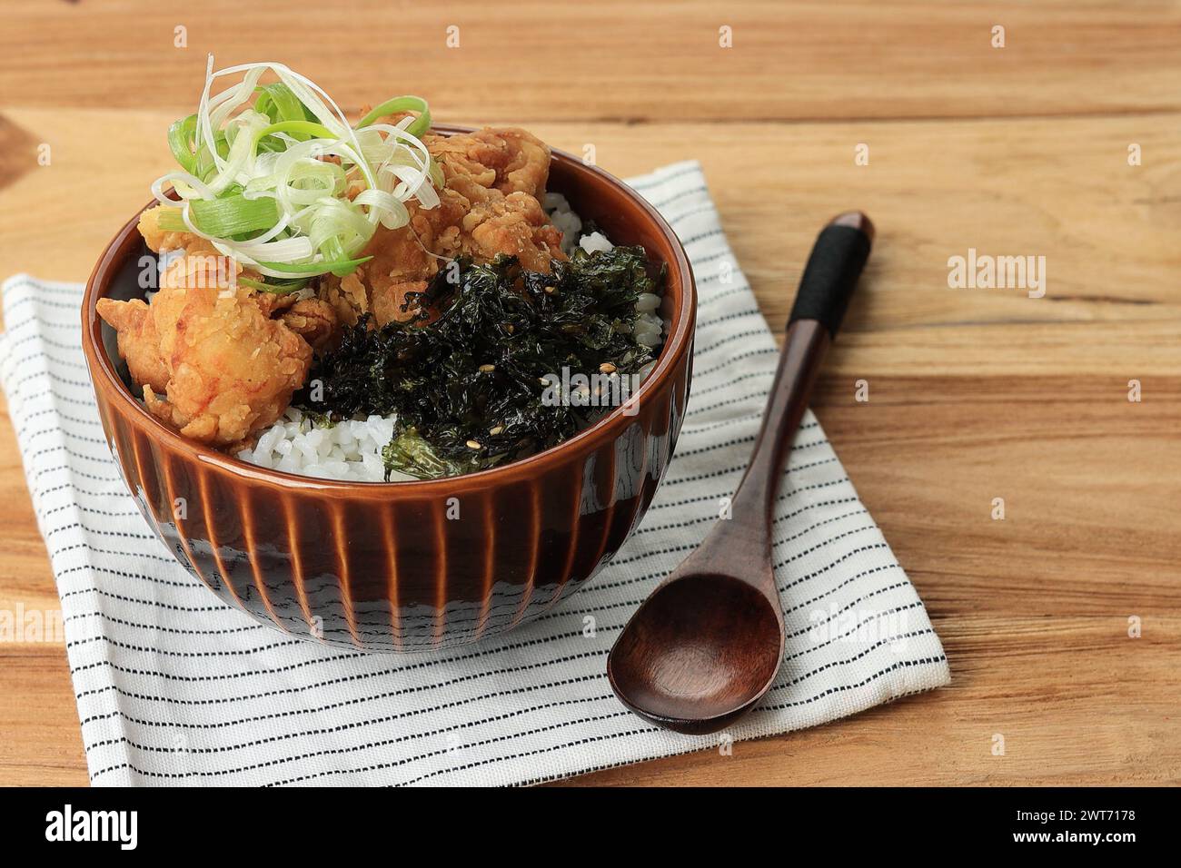 Japanese Rice Bowl with Karaage Topping and Nori Flakes Stock Photo