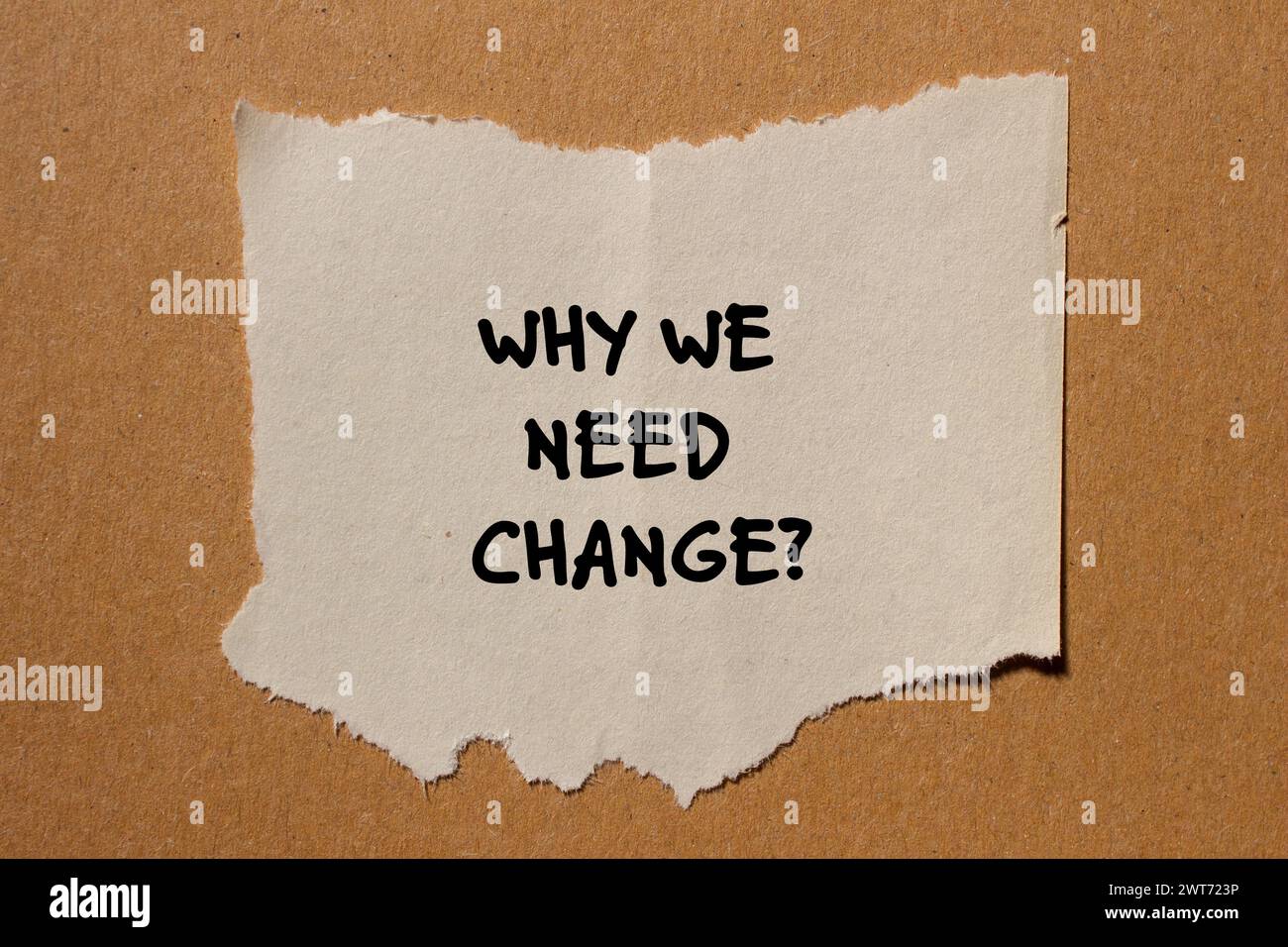 Why we need change words written on torn paper piece with brown background. Conceptual symbol. Copy space. Stock Photo