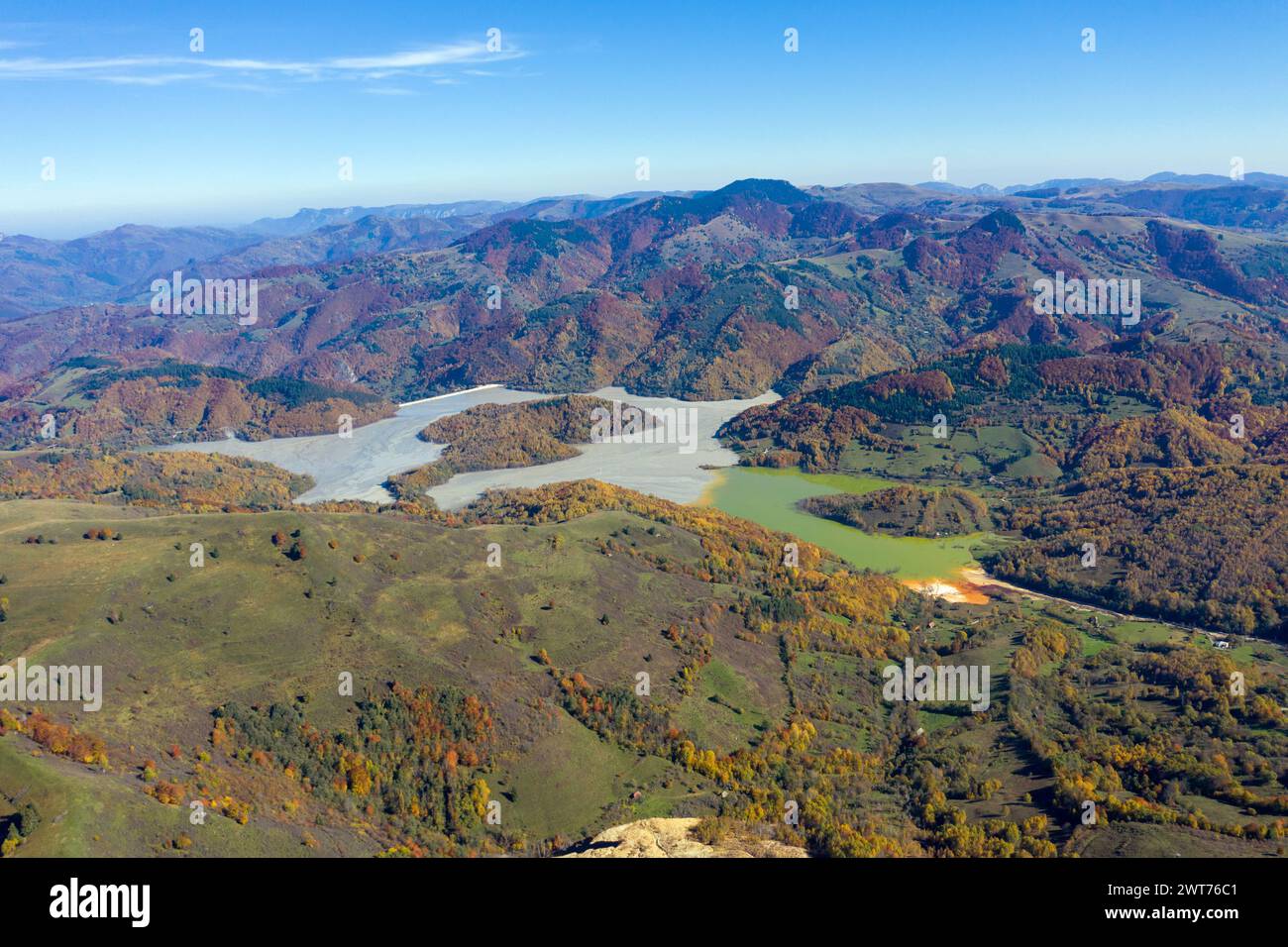 Aerial view of a huge pond, heavy metal copper contamination discharging in lake. Geamana, Rosia Montana, Romania Stock Photo