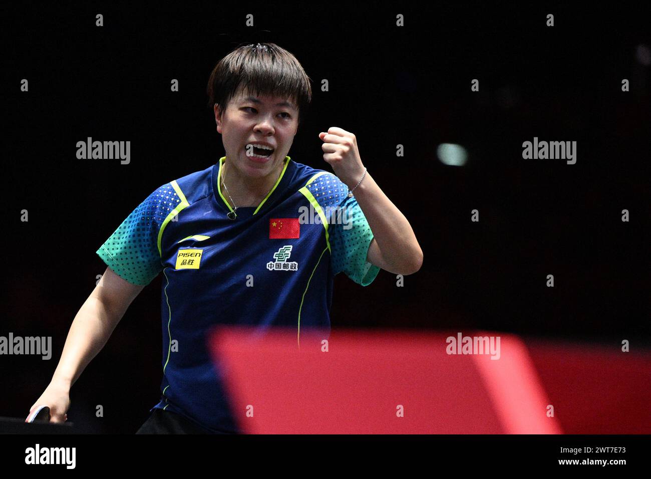 Singapore. 16th Mar, 2025. Wang Yidi of China celebrates scoring during