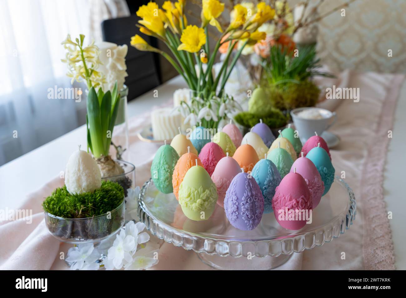 Colorful easter egg soy wax candles. Spring background Stock Photo