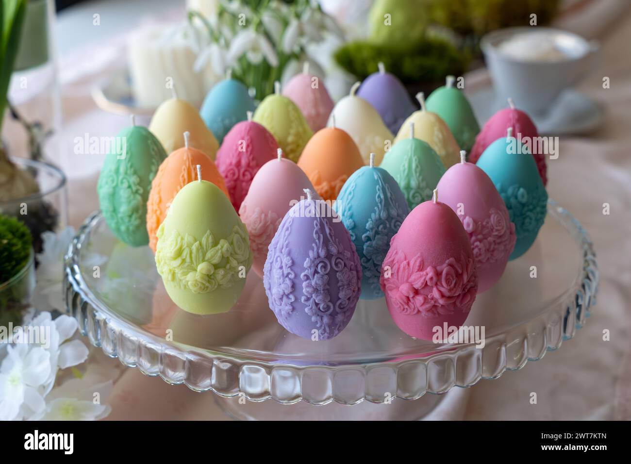 Colorful easter egg soy wax candles. Spring background Stock Photo